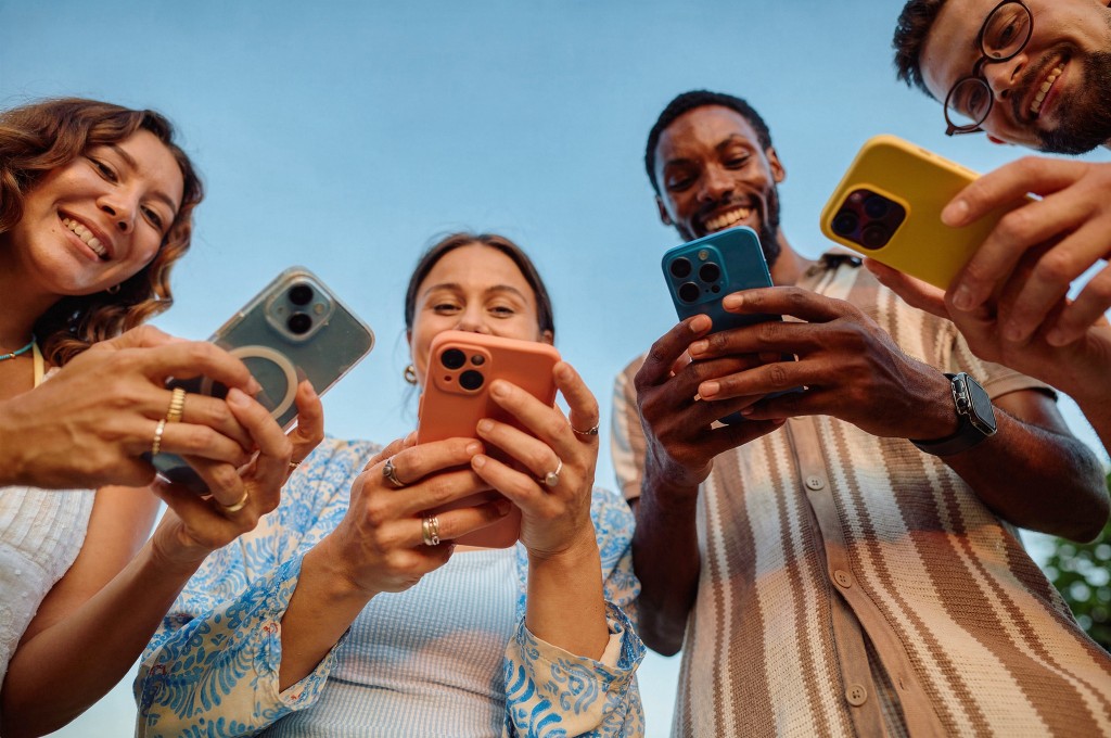 Community members gathered around their phones, reflecting the people Sircularity builds for.